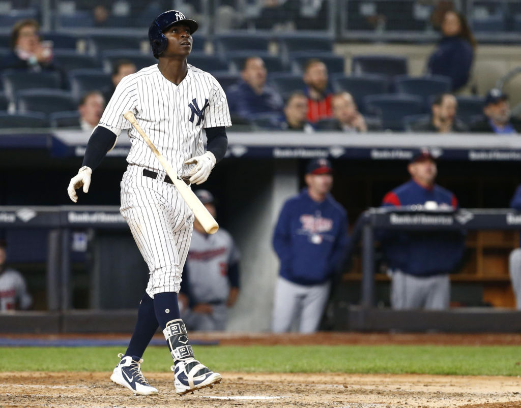 Apr 24, 2018; Bronx, NY, USA; New York Yankees shortstop Didi Gregorius (18) tosses hits bat after hitting a two run home run in the fifth inning against the Minnesota Twins at Yankee Stadium. Mandatory Credit: Noah K. Murray-USA TODAY Sports