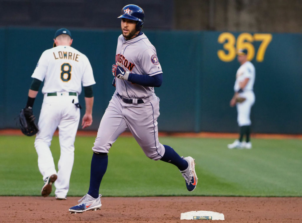 May 7, 2018; Oakland, CA, USA; Houston Astros center fielder George Springer (4) rounds the bases after hitting a three run home run against the Oakland Athletics during the second inning at Oakland Coliseum. Mandatory Credit: Kelley L Cox-USA TODAY Sports