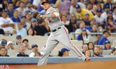 July 5, 2016; Los Angeles, CA, USA; Baltimore Orioles shortstop Manny Machado (13) throws to first after fielding a hit in the sixth inning against Los Angeles Dodgers at Dodger Stadium. Mandatory Credit: Gary A. Vasquez-USA TODAY Sports