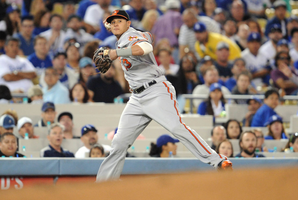 July 5, 2016; Los Angeles, CA, USA; Baltimore Orioles shortstop Manny Machado (13) throws to first after fielding a hit in the sixth inning against Los Angeles Dodgers at Dodger Stadium. Mandatory Credit: Gary A. Vasquez-USA TODAY Sports