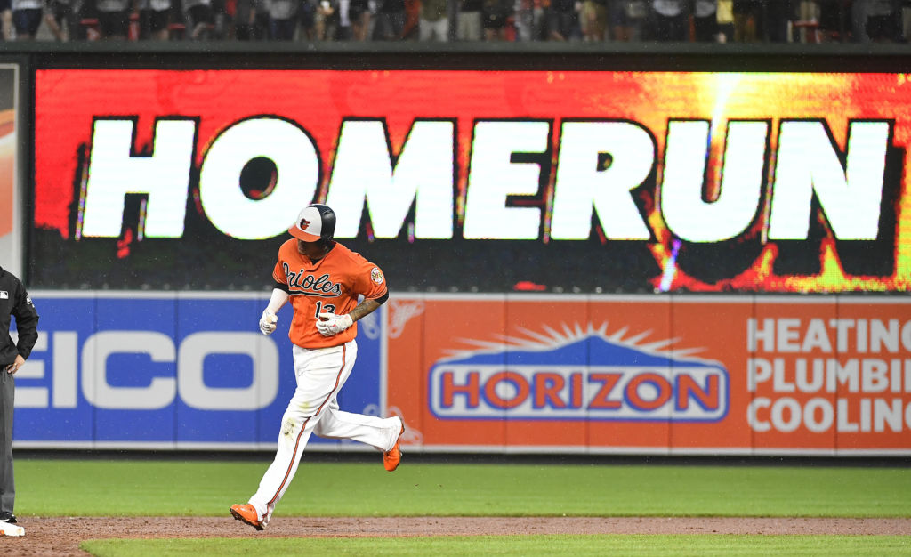 Jun 2, 2018; Baltimore, MD, USA; Baltimore Orioles shortstop Manny Machado (13) rounds the bases after hitting a solo homer against the New York Yankees during the sixth inning at Oriole Park at Camden Yards. Mandatory Credit: Brad Mills-USA TODAY Sports